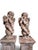 An exceptional and highly decorative pair of 19th-century Italian terracotta cherub sculptures, each presented on its own...