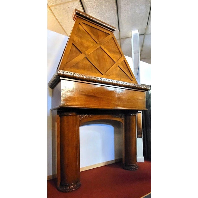 A substantial architectural fireplace in solid wood, dating from the 19th century, boasts a restrained yet majestic...