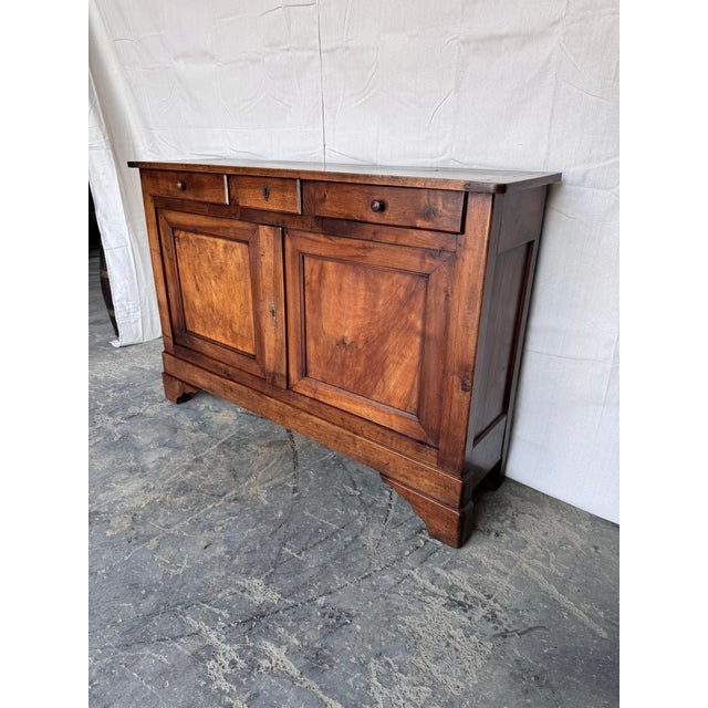 Notice the shallow depth of 15 inches, this is a very unique French server from the early 19th century in walnut which...