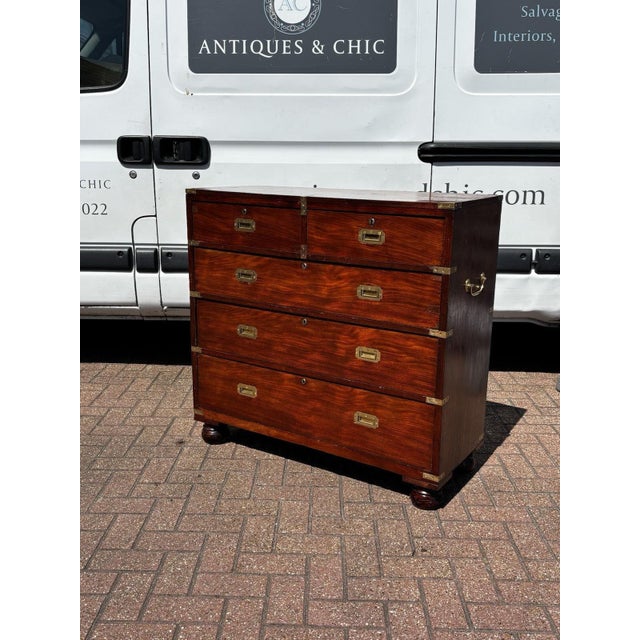 Mahogany Campaign Chest Of Drawers. 98.5 cms high 43 cms depth 102 cms wide An old item so will have signs of use and...
