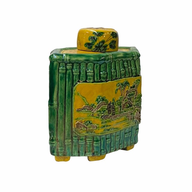 This is a Chinese handmade container jar in rhombus shape with yellow and green color oriental scenery theme. Its unique...