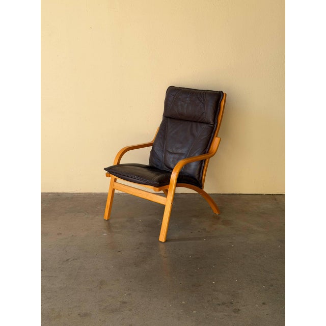 Classic Mid-Century Modern Danish lounge chair by Stouby, crafted in Denmark and designed with the elegant simplicity that...