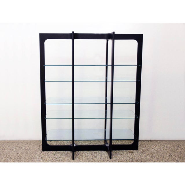 Wood and glass bookcase/display cabinet attributed to Bernini, 1970s. Black lacquered wood frame with steel joints and 5...