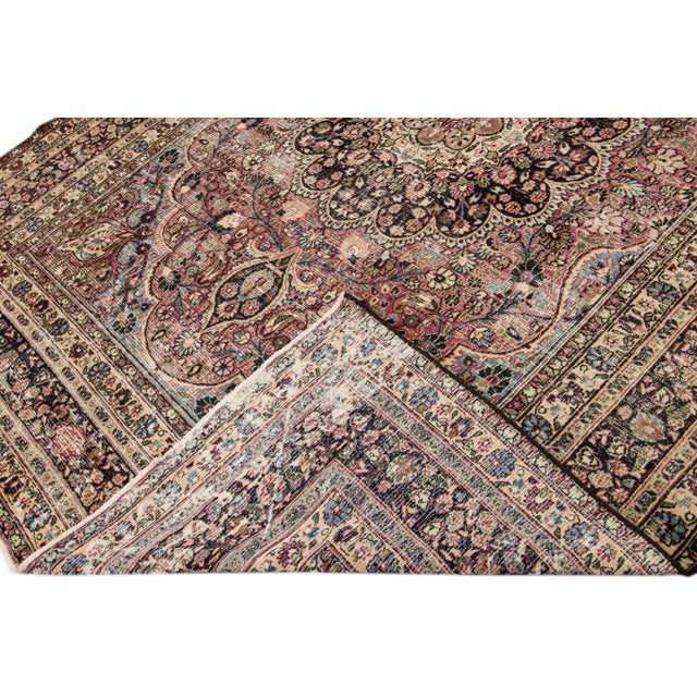 Beautiful Vintage Persian hand-knotted wool rug with a light pink and brown field. This piece has a multicolor Rosette...