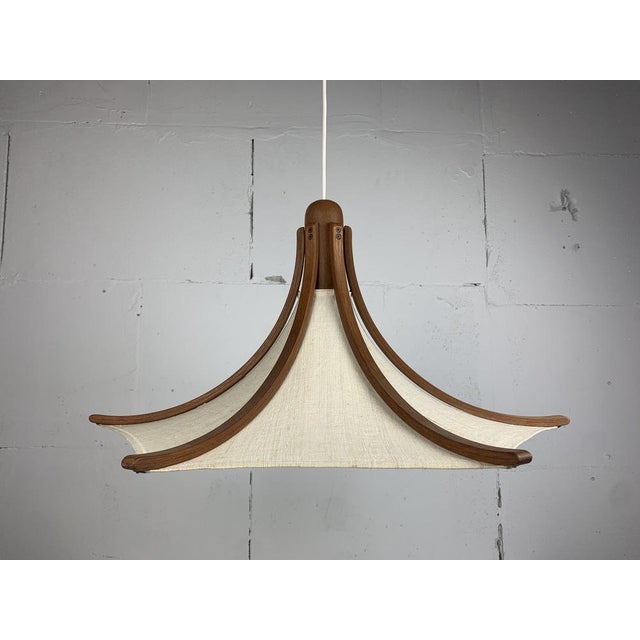 Teak and linen umbrella pendant by Domus, 1970s. This lamp is in great condition considering its age. The linen shade is...