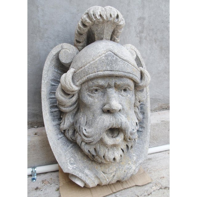 Hand-carved in Italy, this limestone fountain spout depicts the Roman God of war and courage, Mars. As seen here, Mars is...