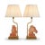 Pair of French table lamps by Le Dauphin from the 1970s. Each features a sculpted horse head in salmon-pink satin glass, a...