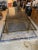 Beautiful brass and glass extension dining table, very rare and useful integrated leaf. Smoky glass panels. Great...