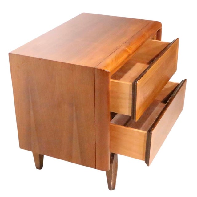 Mid Century two drawer nightstand, made by the American of Martinsville furniture company. The case features two drawers,...