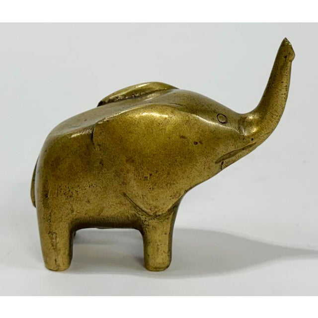 Vintage Mid Century Modern style solid brass elephant paper weight. Clean lines with a charming flair. Patina.