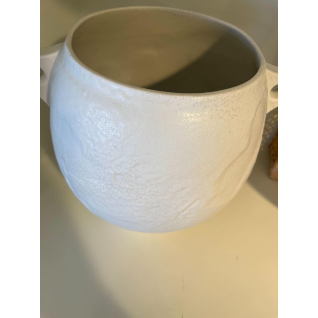 Crafted from white porcelain, the design of the Myla was inspired by ancient Greecian water jars in an urn-style shape....