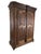 Two doors. The left door carries the central carved stile, which is part of the door, not a fixed post. That stile is hung...