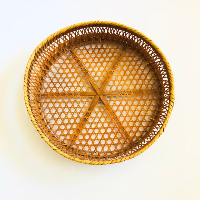 A large vintage circular wicker tray.