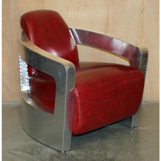 Absolutely stunning pair of Red Wine leather, Aviator Rocket lounge armchairs with polished aluminum hand hammered frames...