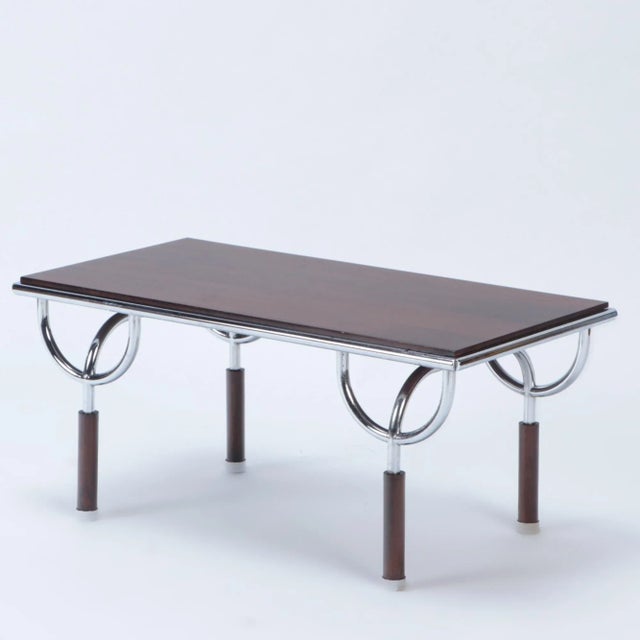 An Italian side table attributed to Roberto Gabetti and Aimaro Isola for Trilogia, model Tri11. Chrome-plated steel frame...