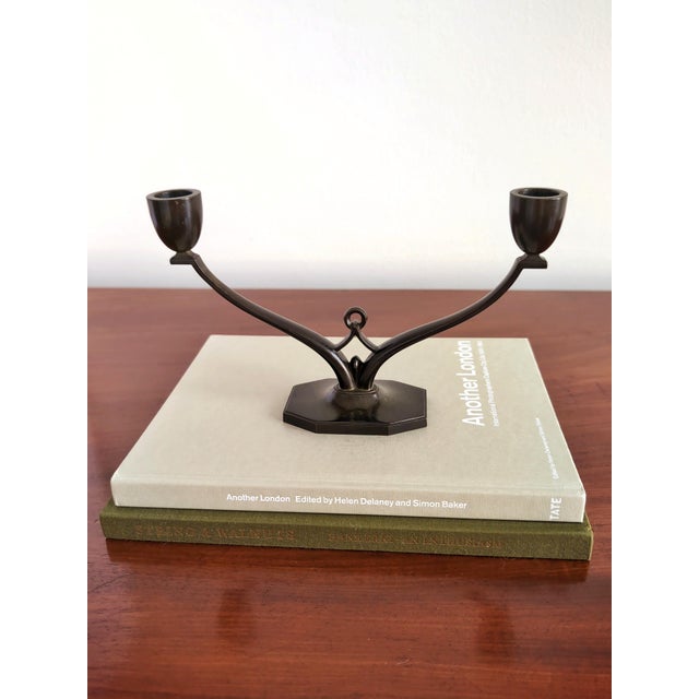 A rare vintage bronze candelabra by one of interior designs most highly acclaimed metalware artisans just andersen. This...