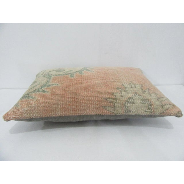 Decorative pillow cover made from a vintage Turkish handknotted rug. Backed with good quality cotton fabric. Pillow...