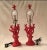 These are beautiful coral orange in color, cast resin pair of table lamps with original matching finials. Shaped to...