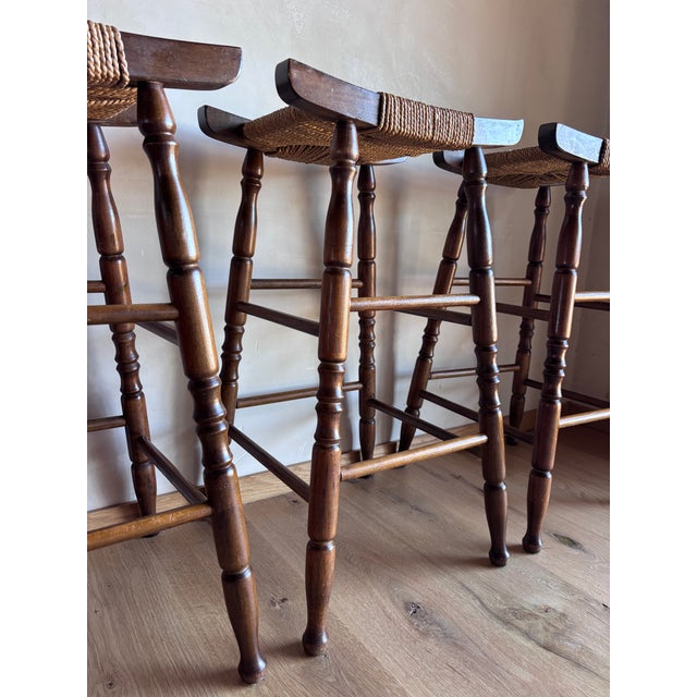 Mid-Century Modern Set of 3 Mid Century Bar Stools Primitive Craft Movement Turned Walnut Bobbin Spindle Legs and Danish Cording Woven Seats For Sale - Image 3 of 13