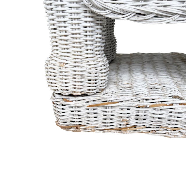 A charming and highly decorative vintage white wicker elephant side table, handcrafted in woven rattan and wicker with a...