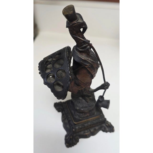 The Antique Bronze Turkey Hearing Challenged Cigar Holder is a unique figurine depicting a turkey with a...