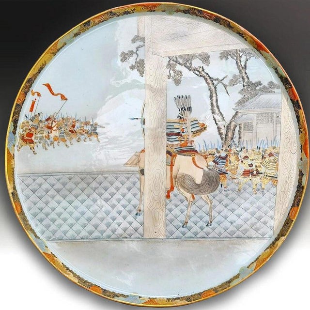 An impressive large Japanese Kutani porcelain tray or charger dating to the Meiji period. The piece is distinguished by...