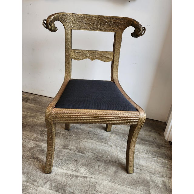 Bring a striking sculptural element into your space with this Vintage Regency Anglo-Indian brass-clad wedding chair....