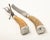 Offering this stunning pair of sterling silver and antler handle carving set. The ends of the antlers are covered in a...