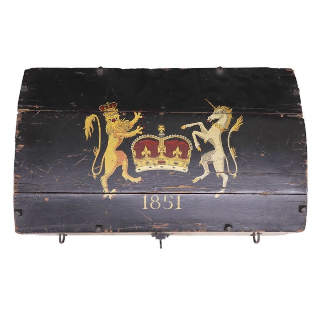 Striking 1851 painted dome-top trunk, featuring bold hand-painted heraldic decoration throughout. The lid is adorned with...