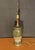 Stunning 1950s-1960s Mid-Century Modern olive green ceramic and wood table lamp. Featuring a cylindrical ceramic body...