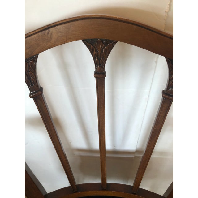 Beautiful vintage carved mahogany Regency style armchair with new dark chocolately supple leather upholstery finished with...