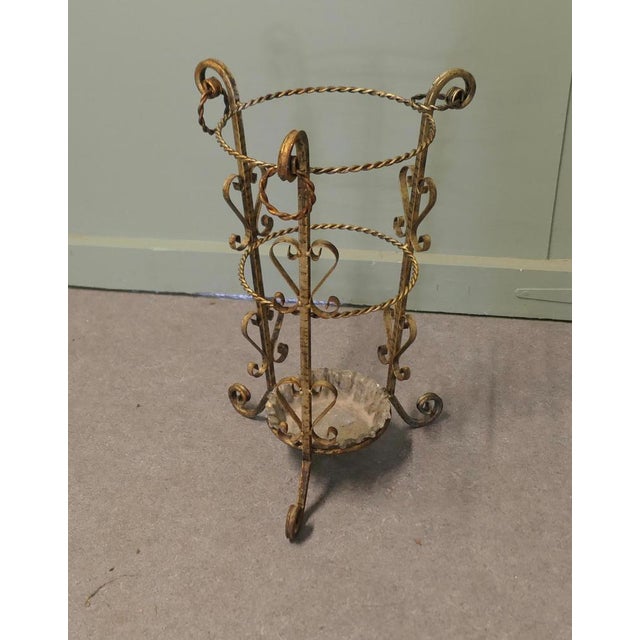 Twisted Metal Walking Stick Stand A charming 1920s piece with a round shape the twisted rings twisting form a holder for...
