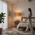 The Stretch Pendant is a modern lighting fixture in NOVA's collection, featuring a satin nickel finish with a burlap...