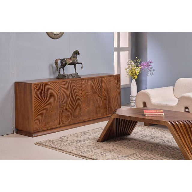 The Morley Four Doors Wood Sideboard brings functional storage and natural warmth to your dining or living space. This...