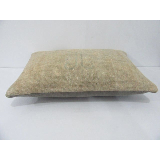 Decorative pillow cover made from a vintage Turkish handknotted rug. Backed with good quality cotton fabric. Pillow...