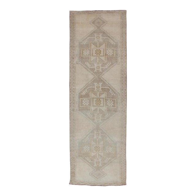 Vintage Turkish Hand Knotted Oushak Runner With Etched Medallion Design in Soft Muted Tones For Sale