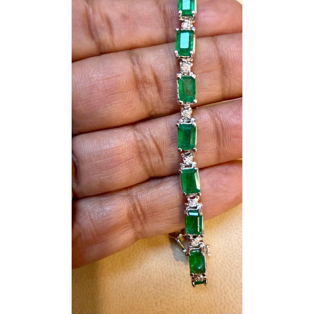 Approximately 9 Carat Emerald cut Emeralds &amp; Diamond Tennis Bracelet 14 Karat White Gold Size 7 inches long This...