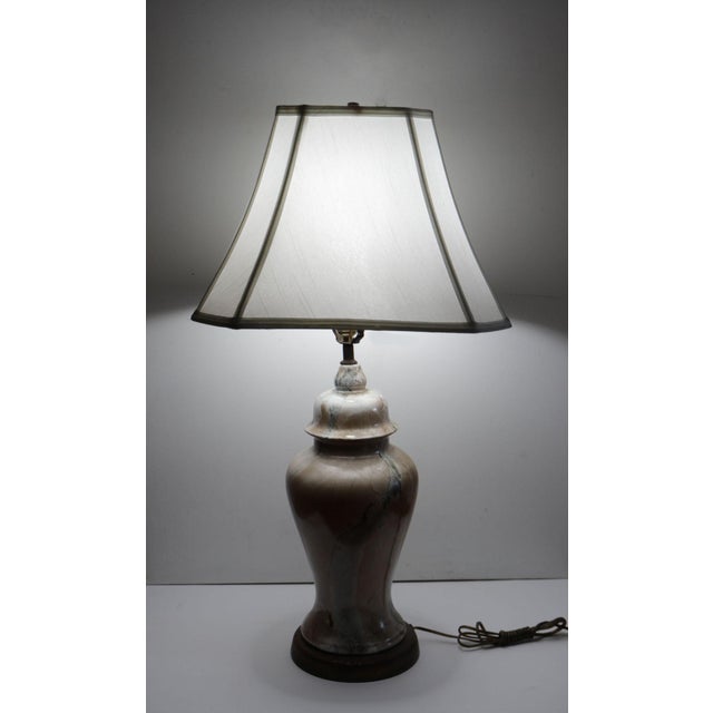 Marbelized glass lamp makes a beautiful design statement with vintage style.. This classic piece is a marbleized glass...