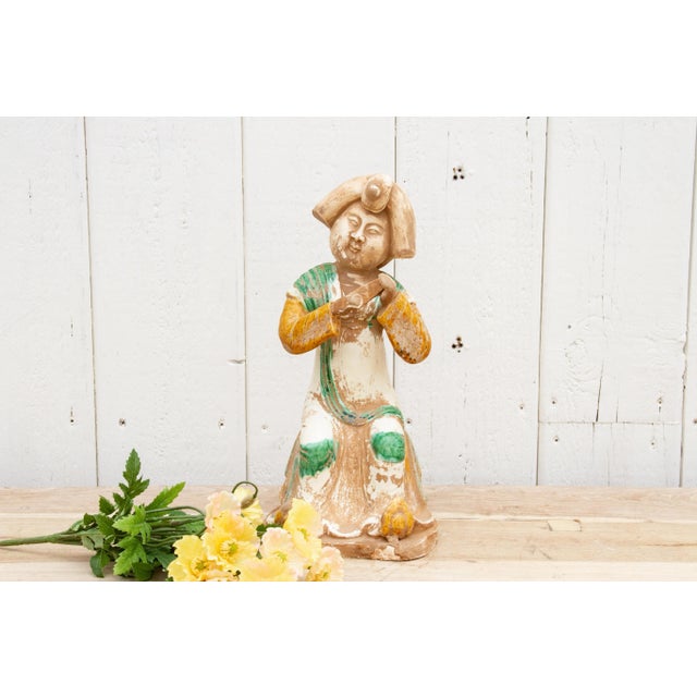 Lovely Sancai style pottery statue of a "woman of the court”. This vintage Chinese terra-cotta statue shown in a seating...