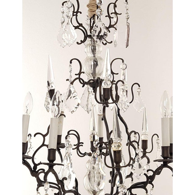 A French vintage Louis XV–style bronze and crystal chandelier.