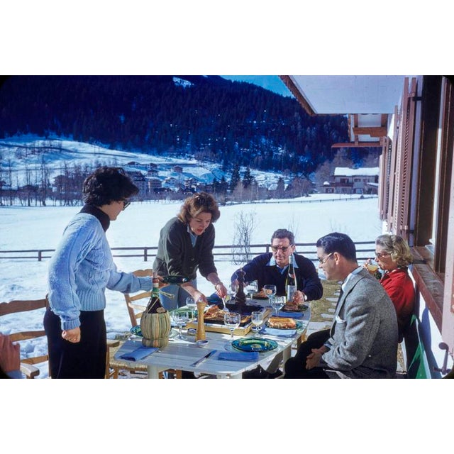 Pizza In The Snow by Toni Frissell A group of friends enjoy an alfresco après-ski pizza, 1959. (Photo by Toni Frissell)...