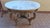 Gilded round table with pink marble top – 1970sImportant round table from the 1970s, featuring a richly gilded frame and...