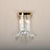 Elegant wall lamp of brass and crystal glass by Novaresi, Italy, 1970s. The clear, curved crystal prisms are mounted on a...