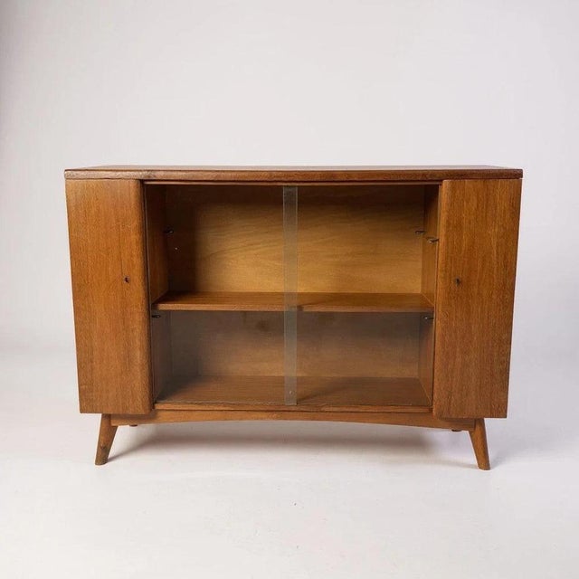 This mid-century drinks cabinet combines classic style with practical storage to elevate your living or dining room....