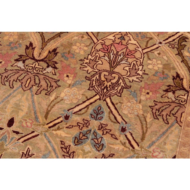Designed with mesmerizing intricacy and gorgeous color palette, this hand-knotted masterpiece demonstrates the beauty and...