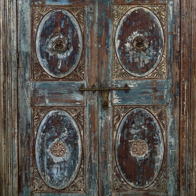 Armoire constructed from antique Indian painted teakwood doors, its original facade and reclaimed wood, this armoire...