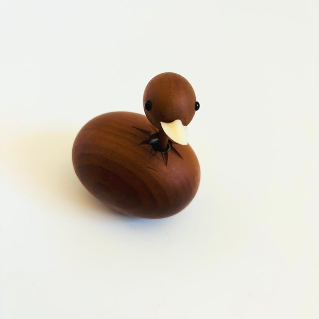 A mid century turned wood figurine in the shape of a ostrich. Adorable stylized features. Made in Japan by Senshukai as...