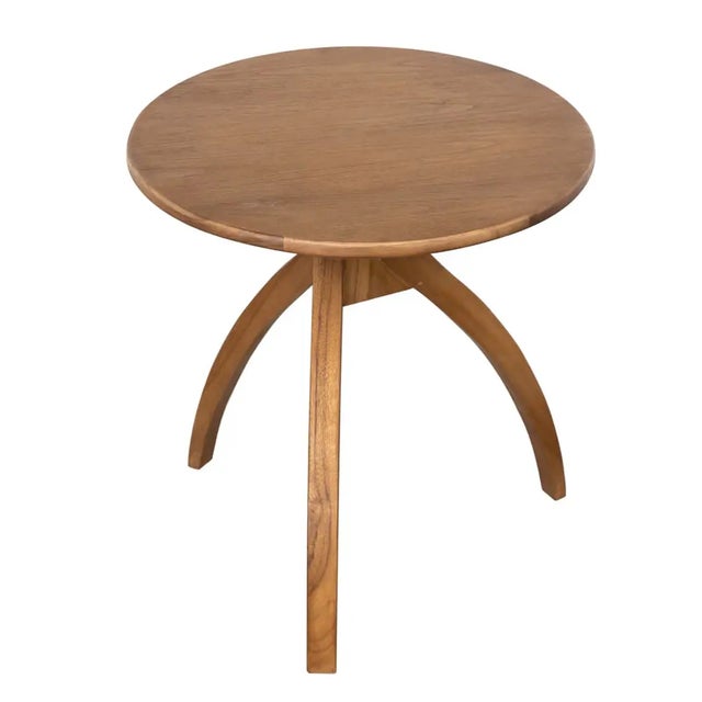 Introduce a touch of modern elegance to your living space with the Vikram Side Table. Crafted entirely from premium teak...