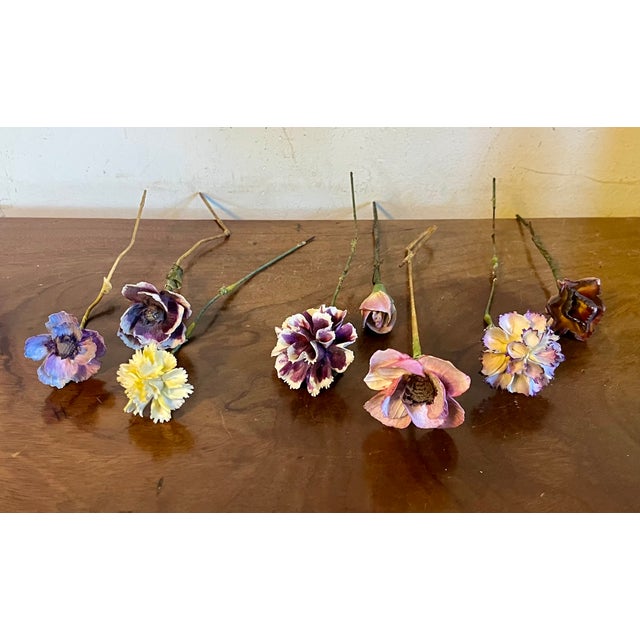 Antique early 20th century French tromp l'oeil porcelain flowers mounted on cloth wrapped wire stems. Specimens include...