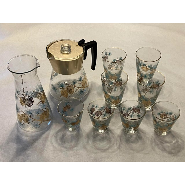 This beautiful mid-century modern set includes a carafe, pitcher, four small glasses and four large glasses. This classic...